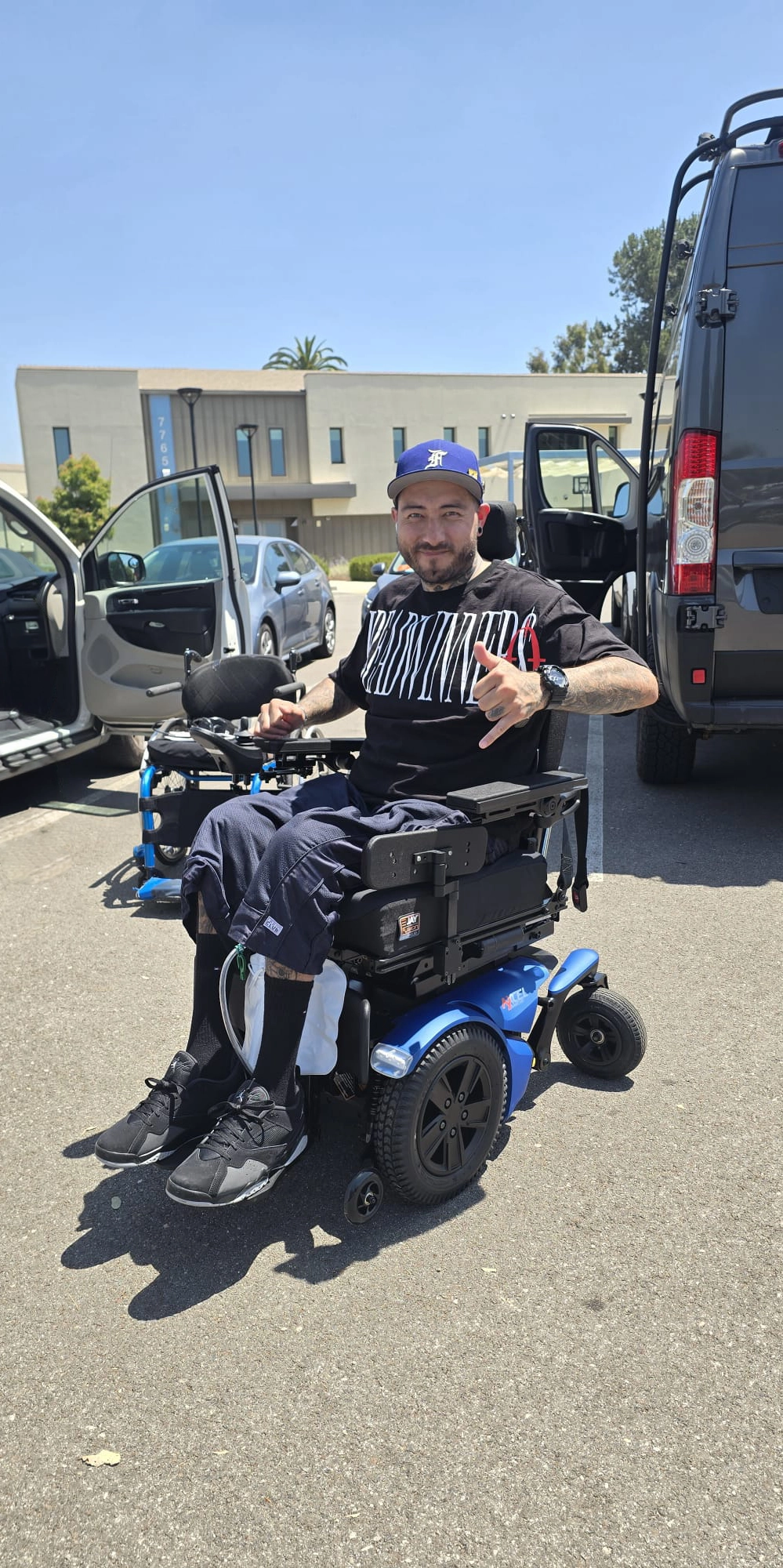 Feroz Medical patient in their custom power wheelchair on delivery day