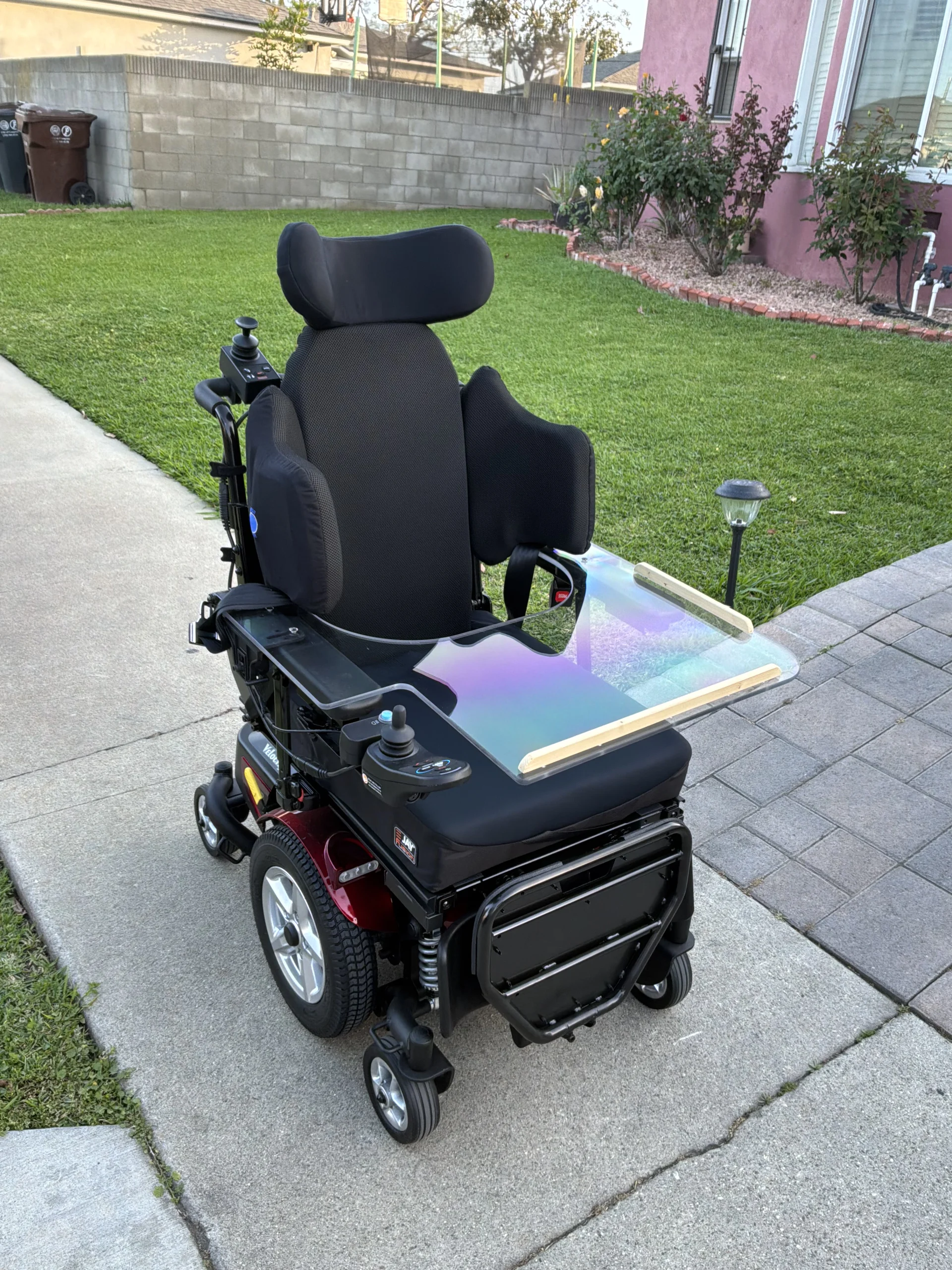 Custom power wheelchair build with a removable acrylic lap tray, configured by Feroz Medical